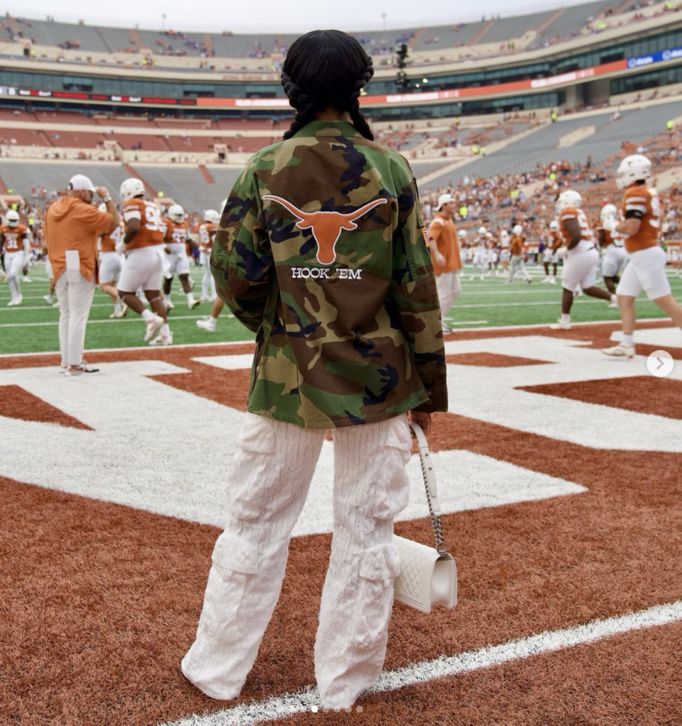 Loreal Sarkisian Wearing a military jacket at the UT Football game